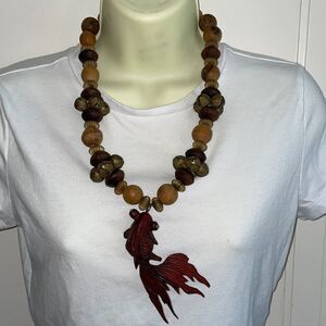 Large, chunky possibly vintage carved rosewood koi fish necklace with glass eyes